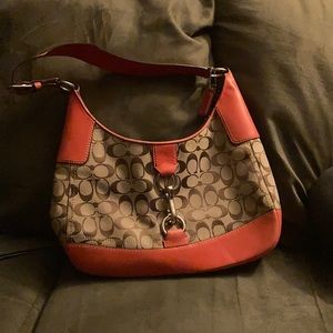 Coral and tan shoulder coach bag